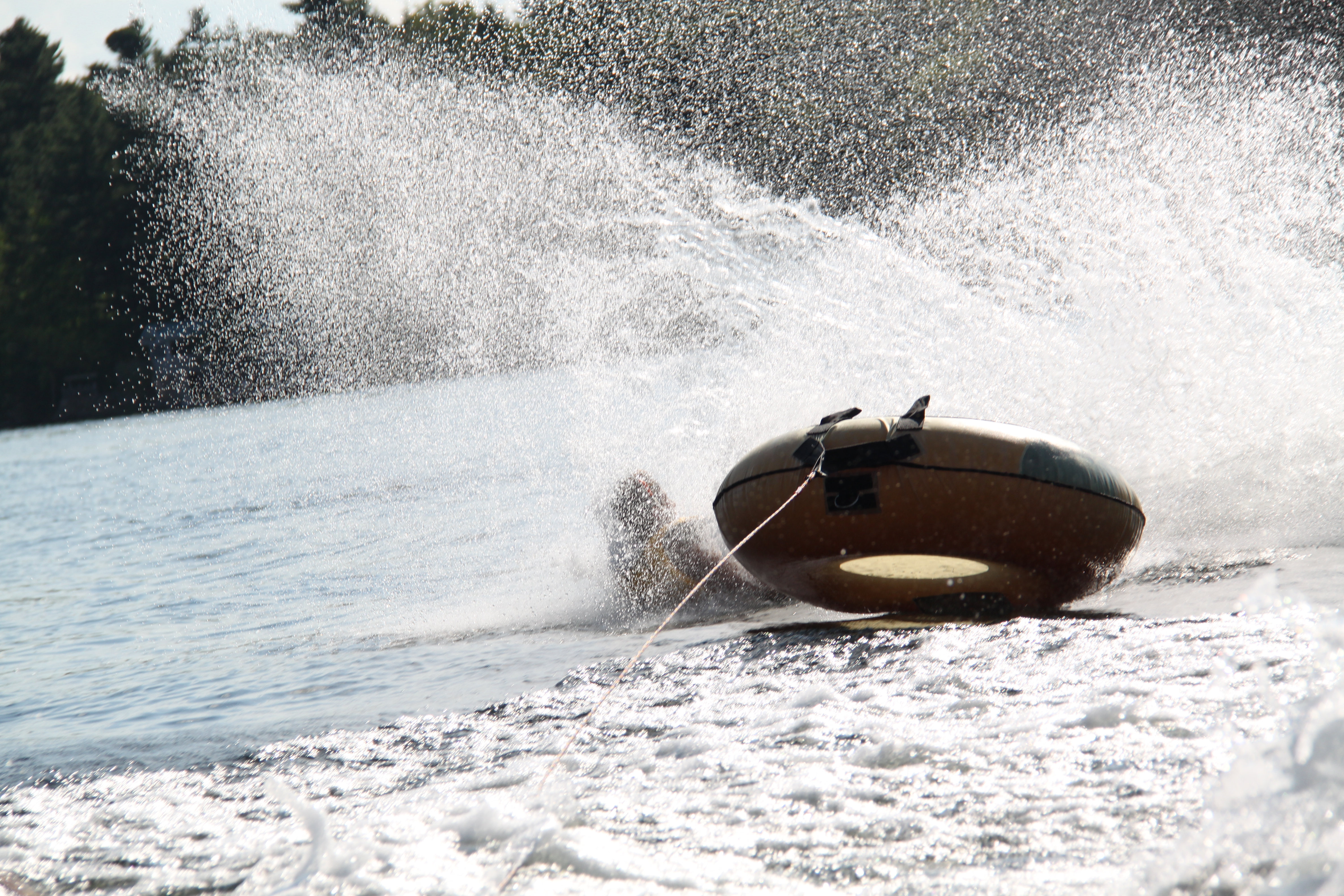Tuber getting dunked in Charleston Lake, Ontario.